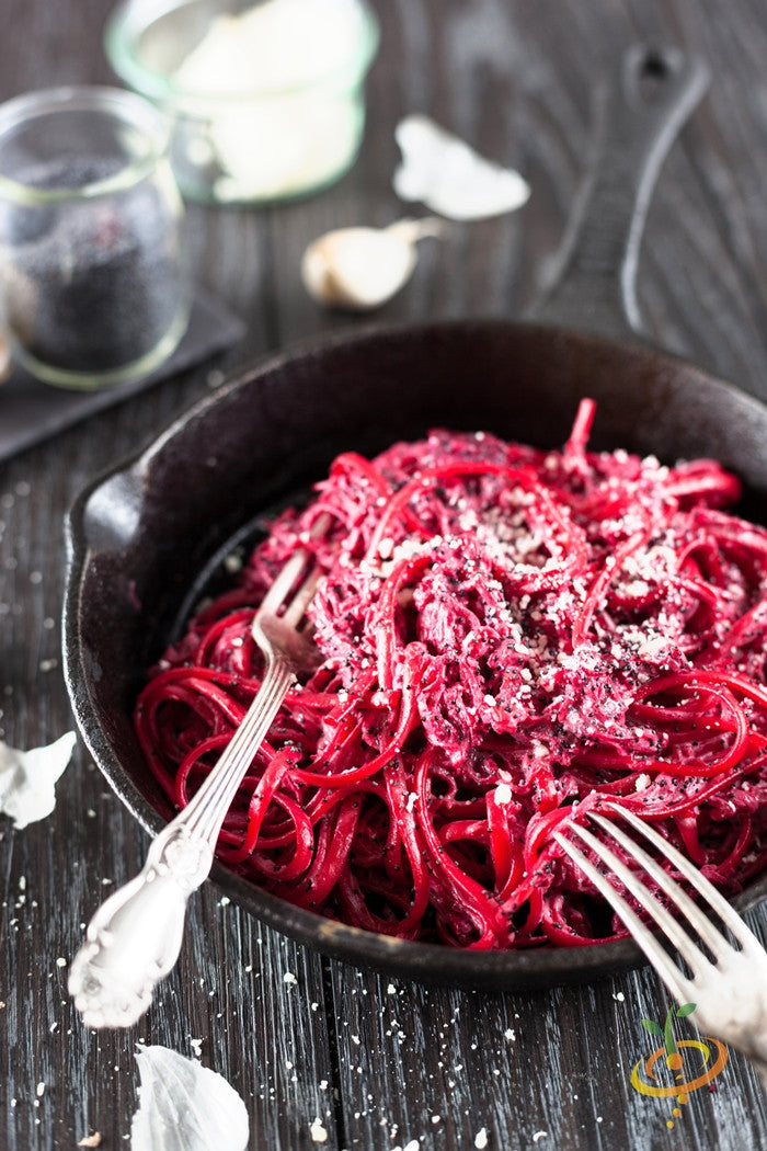 Dark red Detroit beet seeds from SeedsNow, shown in a close-up image with vibrant green leaves and fresh seed packaging.