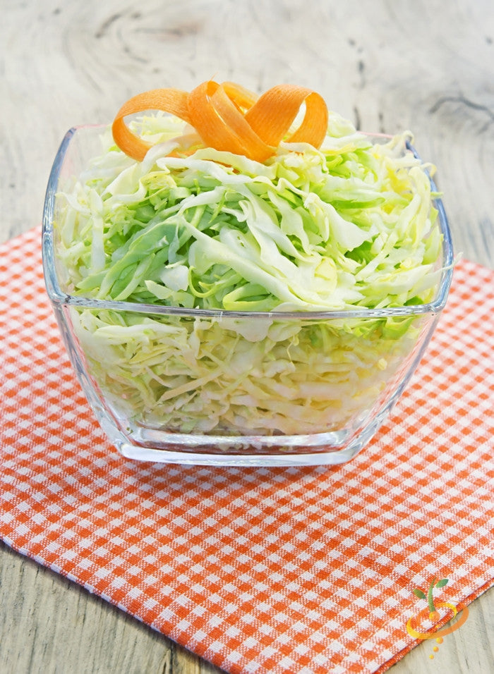Fresh green Copenhagen cabbage from SeedsNow, shown in a close-up image highlighting leafy vegetable with vibrant greens.
