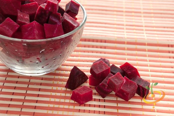 Fresh early Wonder beet from SeedsNow, showcasing vibrant green leaves and deep red root, ideal for home gardening.